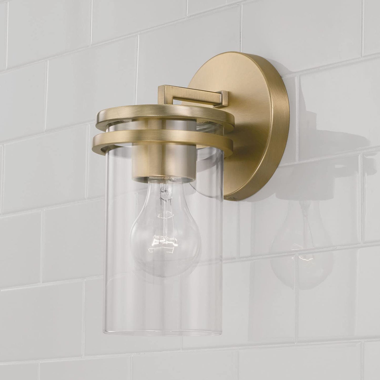 HomePlace by Capital Lighting 648711AD-539 Fuller Transitional Clear Glass Cylinder Wall Sconce, 1-Light 100 Watt, 10" H x 5" W, Brass