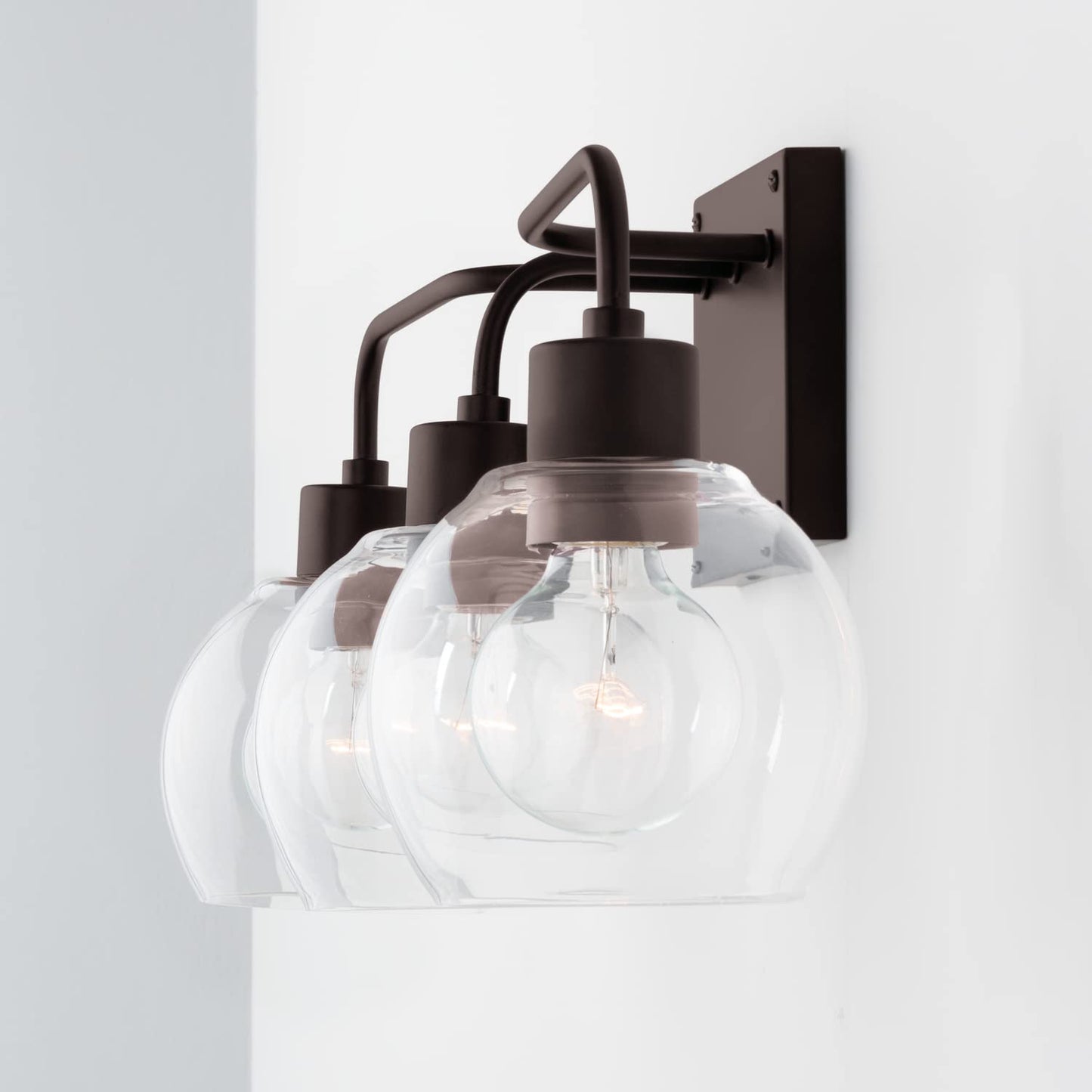 HomePlace Lighting 120031BZ-426 Tanner Urban/Industrial Clear Glass Bathroom Vanity Wall Light, 3-Light 300 Total Watts, 10" H x 25" W, Bronze