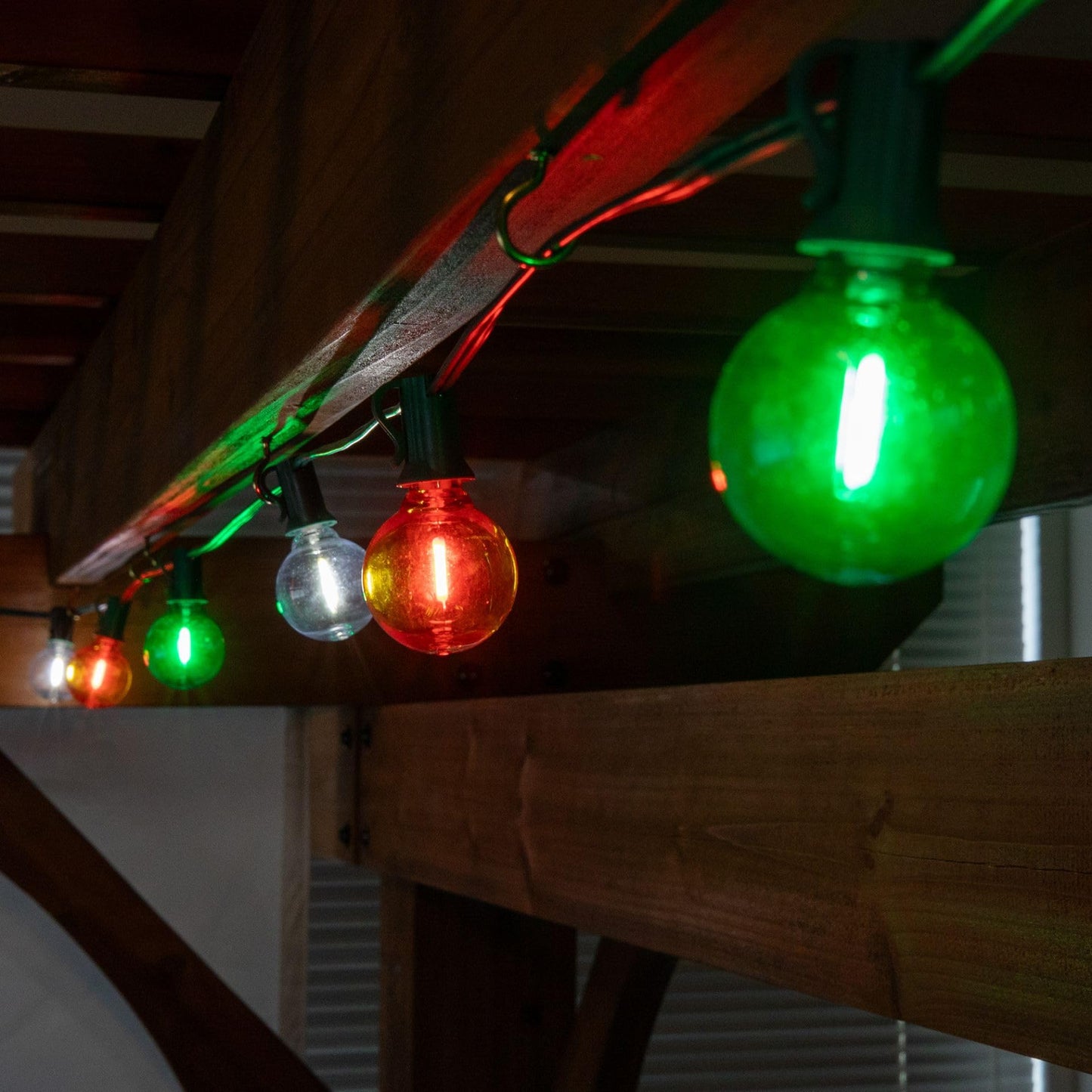 Novelty Lights G40 Filament LED String Light, Translucent Orange/Green/White Bulbs, 25 Globe Lights with 12" Spacing on Green Wire, Indoor/Outdoor