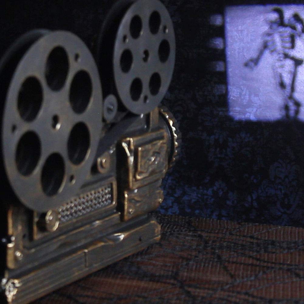 Animated Haunted Movie Projector with Sound Halloween Decoration, 3 3/4" W x 10 1/2" L x 5 1/4" H, by Magic Power