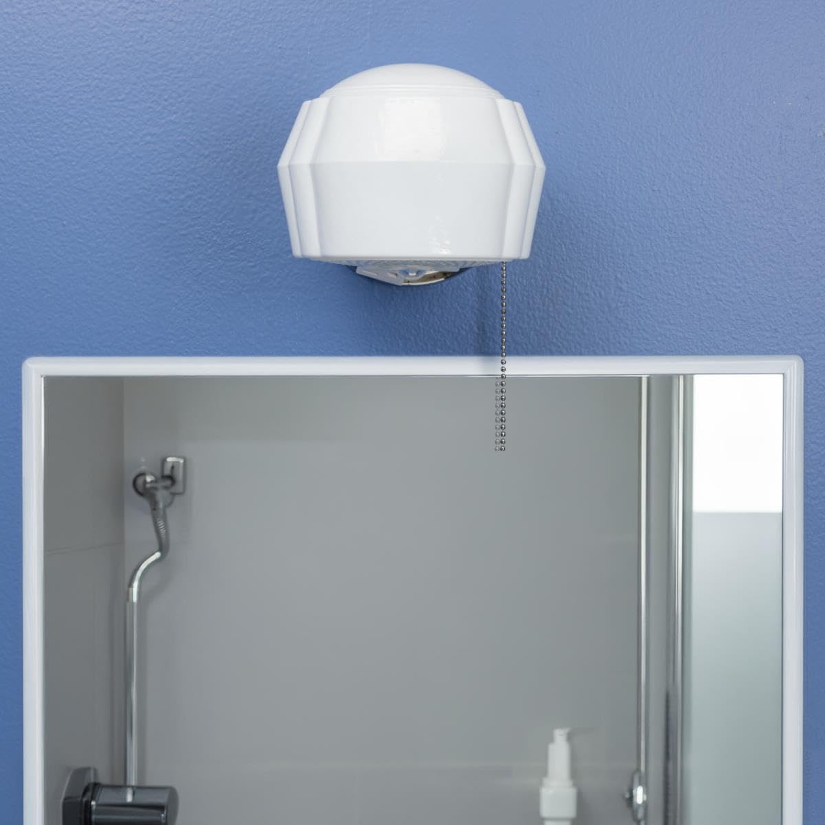 One-Light Classic Wall Fixture with Ground Convenience Outlet and Pull Chain, Chrome Finish Base with White and Crystal Glass