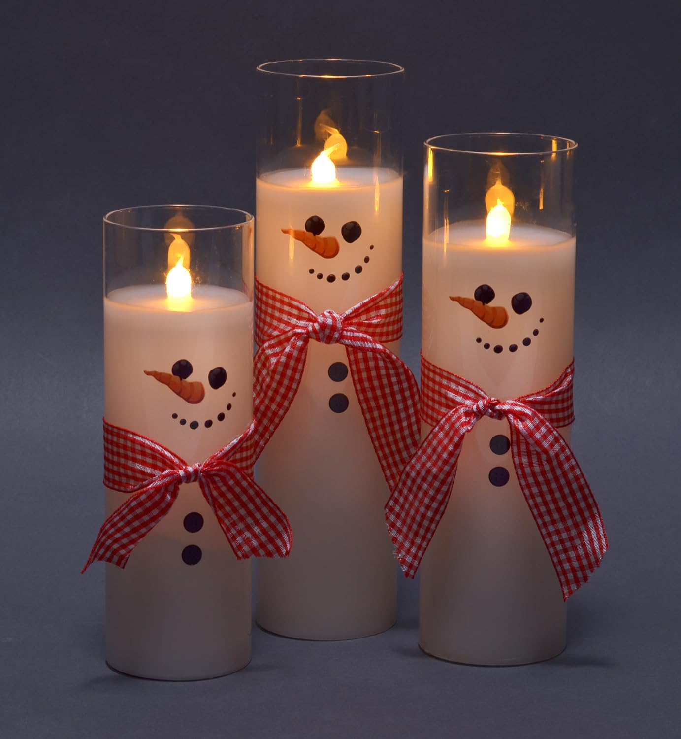 Mark Feldstein & Associates Pre Lit LED Flameless Skinny Winter White Snowmen Wax Filled Glass Pillar Candles, Set of 3, 9 Inch