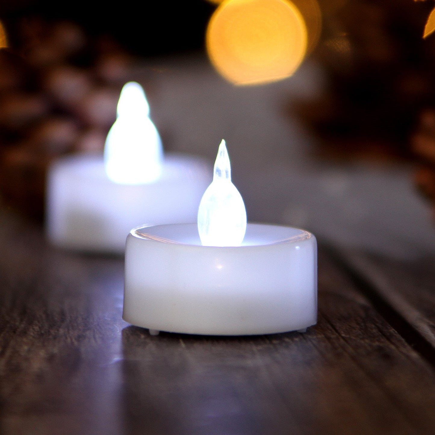 AGPTEK Tea Lights with Flicker,100 Pack Flickering Flameless LED Candles Battery Operated Tealight Candles Long Lasting Tealight for Wedding Holiday