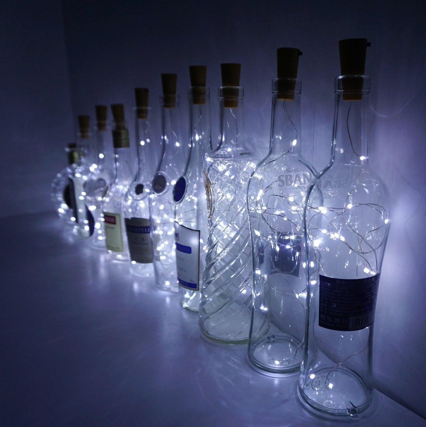 Decorman 10 Pack Solar Powered Wine Bottle Lights, 10 LED Waterproof Copper Cork Shaped Lights